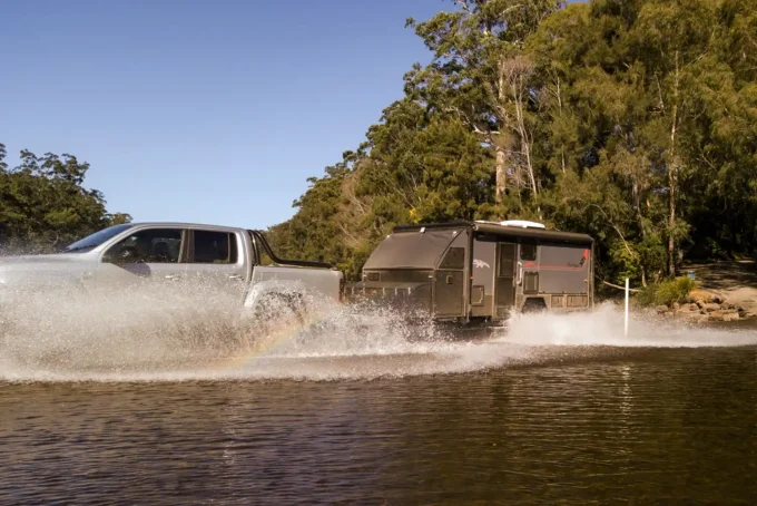 blue tongue camper xh16 hybrid caravan towed through water